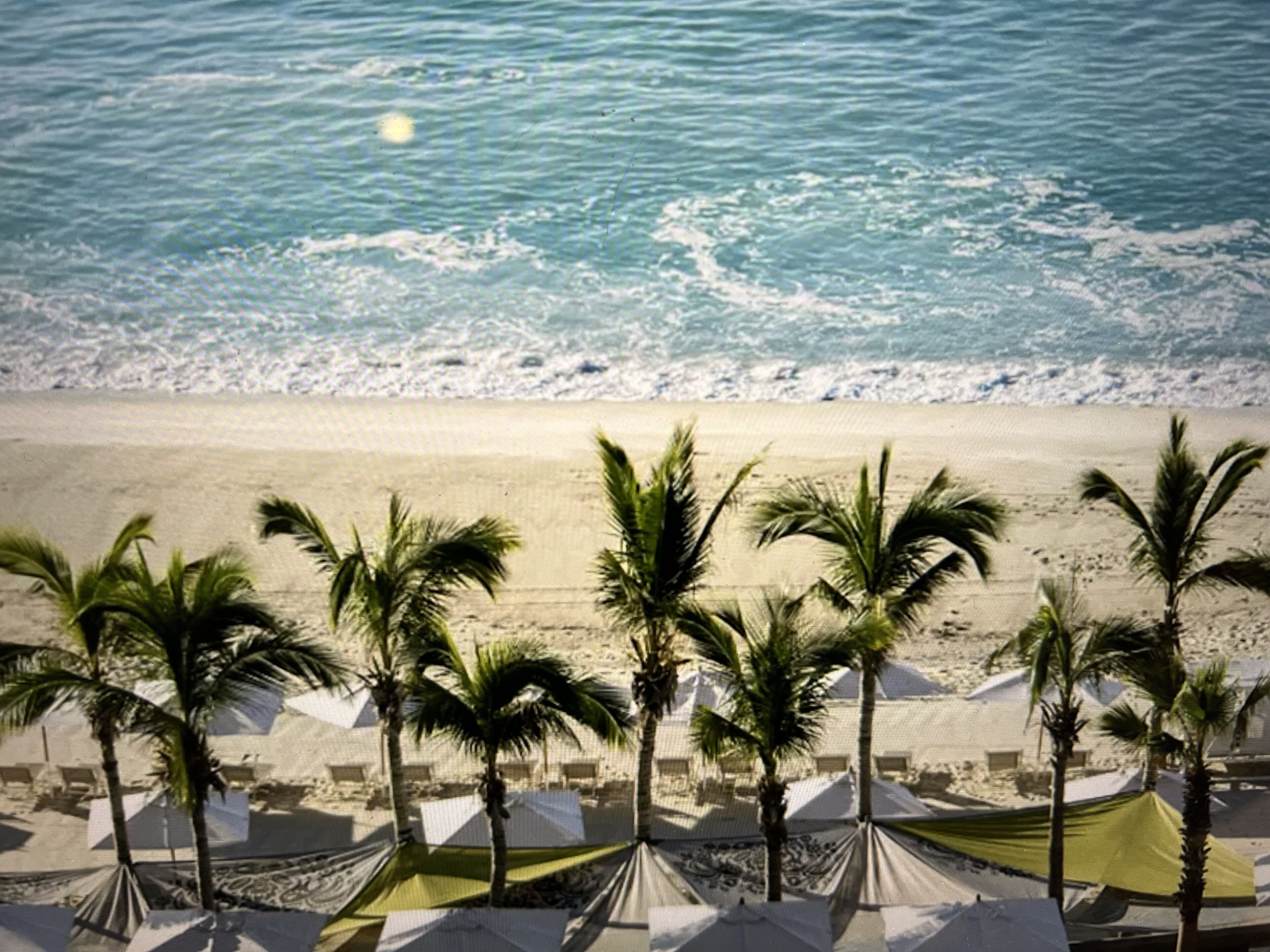 On the beach, sun-loungers, beach towels
