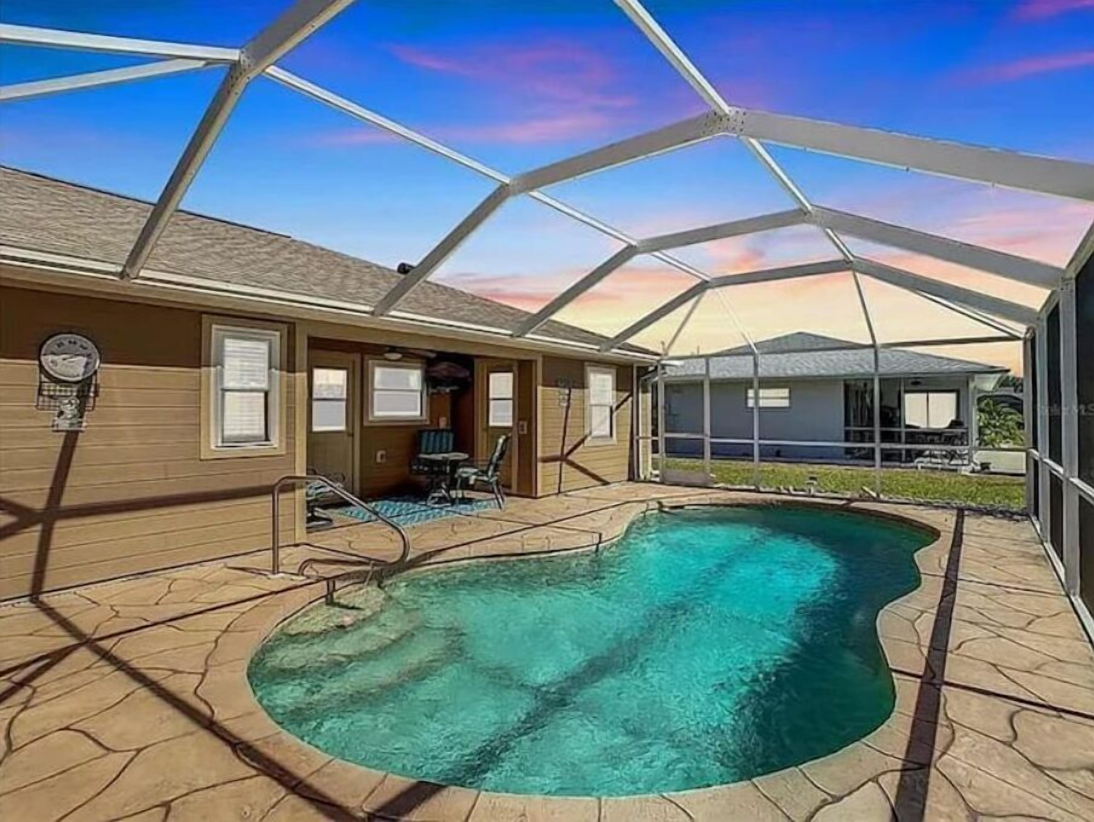 Enjoy this Large Lazy lanai 3 bed  2 bath private pool with canal view!