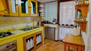 Villa | Private kitchen | Fridge, microwave, oven, stovetop