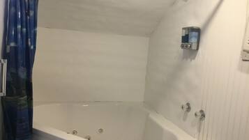 Jetted tub, hair dryer, towels, soap