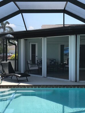 Outdoor pool, a heated pool -  VRBO House with nice solar heated pool and lanai, close to restaurants. (Cape Coral)