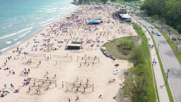 A beach with volleyball courts and people. - Rare East Side-2 min walk to UWM-Garage-Lake Mich (Milwaukee)