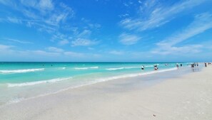 A beach with clear skies and calm waters.