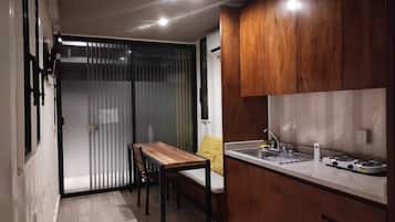 Full-size fridge, cleaning supplies