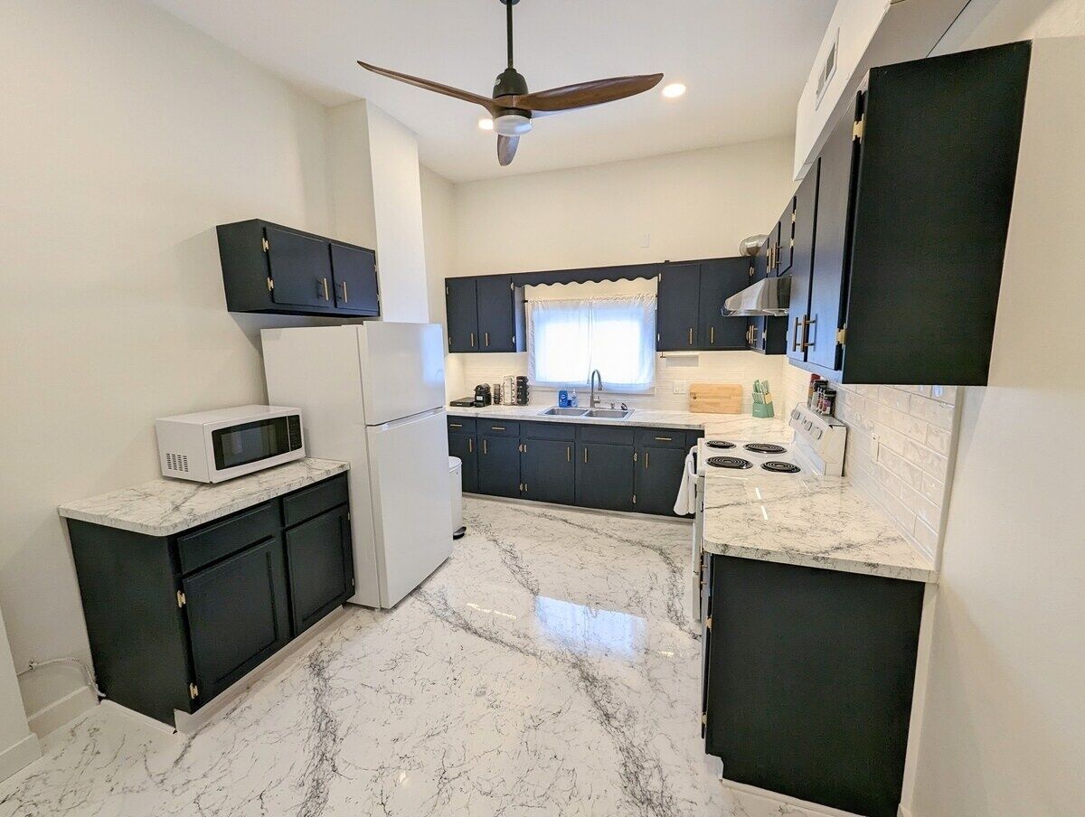 Fridge, coffee/tea maker, cookware/dishes/utensils, spices