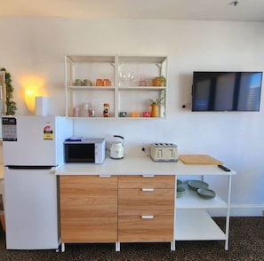 Fridge, microwave, coffee/tea maker, toaster