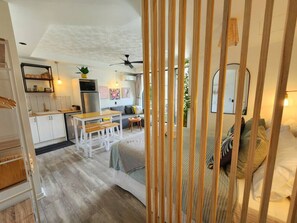 Relax in this open-plan living space with a kitchen, dining, and seating area.