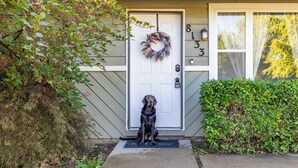A house with a front door, a mailbox, and a number 8133 on the wall. - Cozy Boise Gem: Private Yard, Game Room & Workspace
 (BOISE)