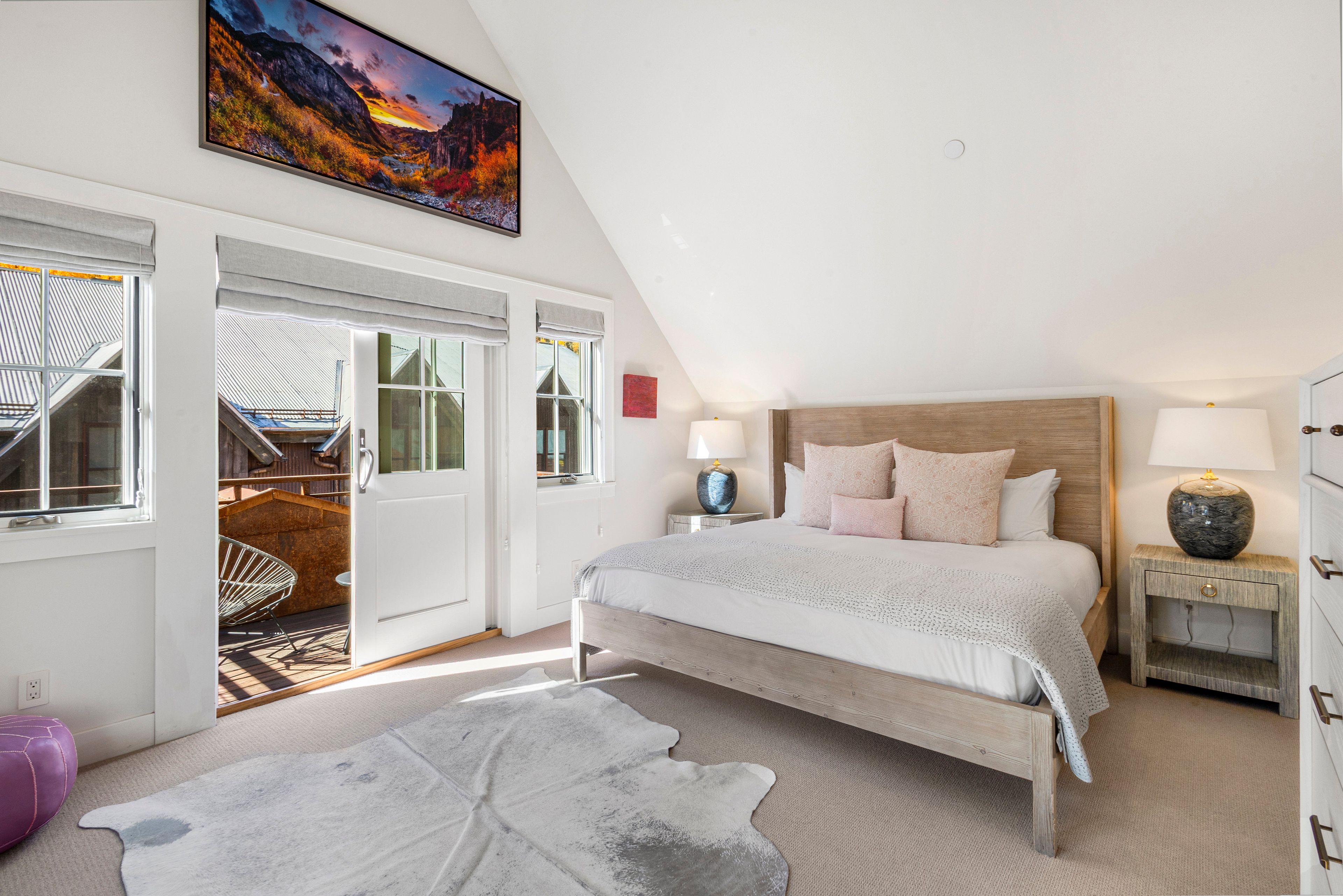 Relax in the beautiful primary bedroom with private deck and ensuite bathroom.