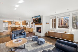 A modern living room with a fireplace, a television, and a dining area. - Walk to Ski! Luxury Telluride Townhome | Walk to Gondola, Main Street & River Trail |  | Sleeps 8 (Telluride)