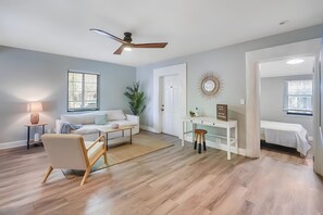 Relax in this inviting living space with a sofa, coffee table, and potted plant.