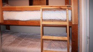 A bunk bed with a wooden ladder and white bedding. - 119 LE Sunny Snow 1650 (LES ORRES 1650)