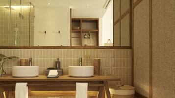 A modern bathroom with two sinks, a large mirror, and a wooden vanity.