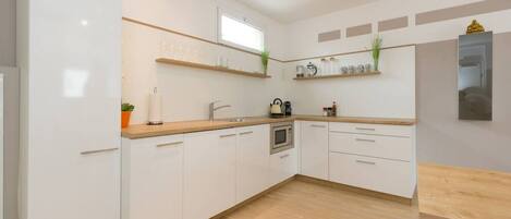 Fridge, microwave, stovetop, coffee/tea maker