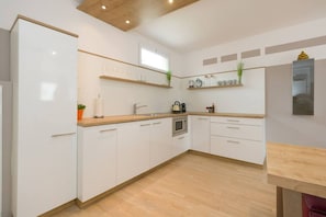 Fridge, microwave, stovetop, coffee/tea maker