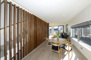 Enjoy a semi- space with a round table for four and a large window offering a view of the outdoors.