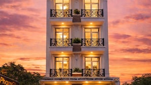 A multi-story building with a sign reading 'PhamGia Hotel' at the top. - Pham Gia Hotel Mui Ne (Mui Ne)