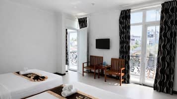 Deluxe Quadruple Room | Minibar, in-room safe, desk, soundproofing