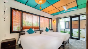 A hotel room with two beds, a ceiling fan, and large windows with blinds. - Sunkissed Paddy Hoi An Villa (Da Nang)