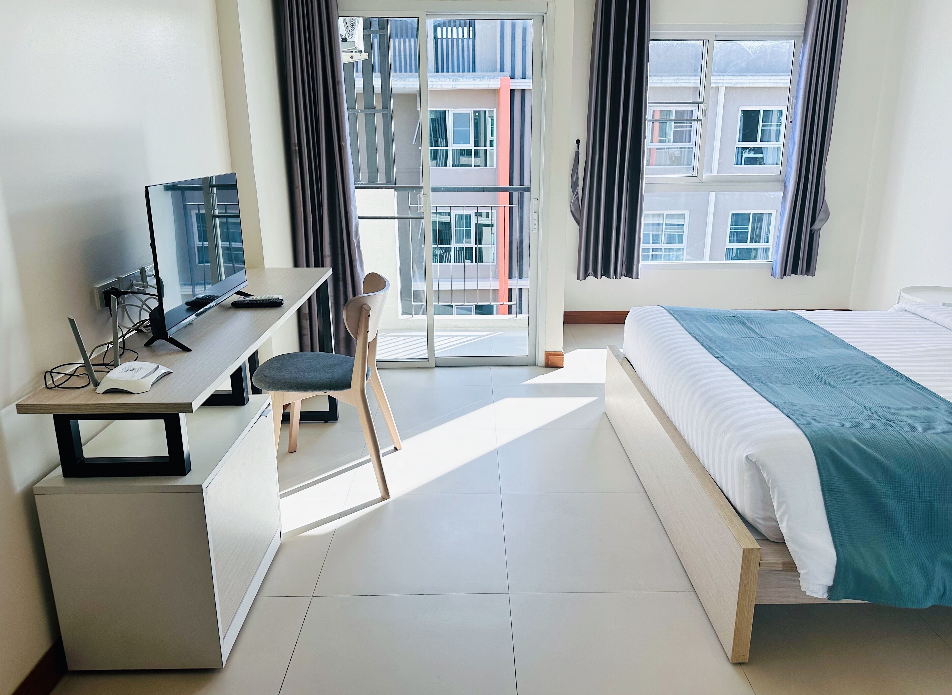 Desk, laptop workspace, blackout drapes, iron/ironing board