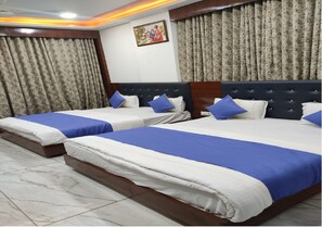 Deluxe Quadruple Room | Premium bedding, free WiFi, bed sheets