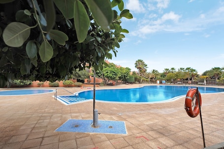 Pool. Vacation Home "Ático Beach Sotavento" with Shared Pool & Wi-Fi
