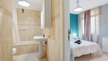 Bathtub, hair dryer, towels