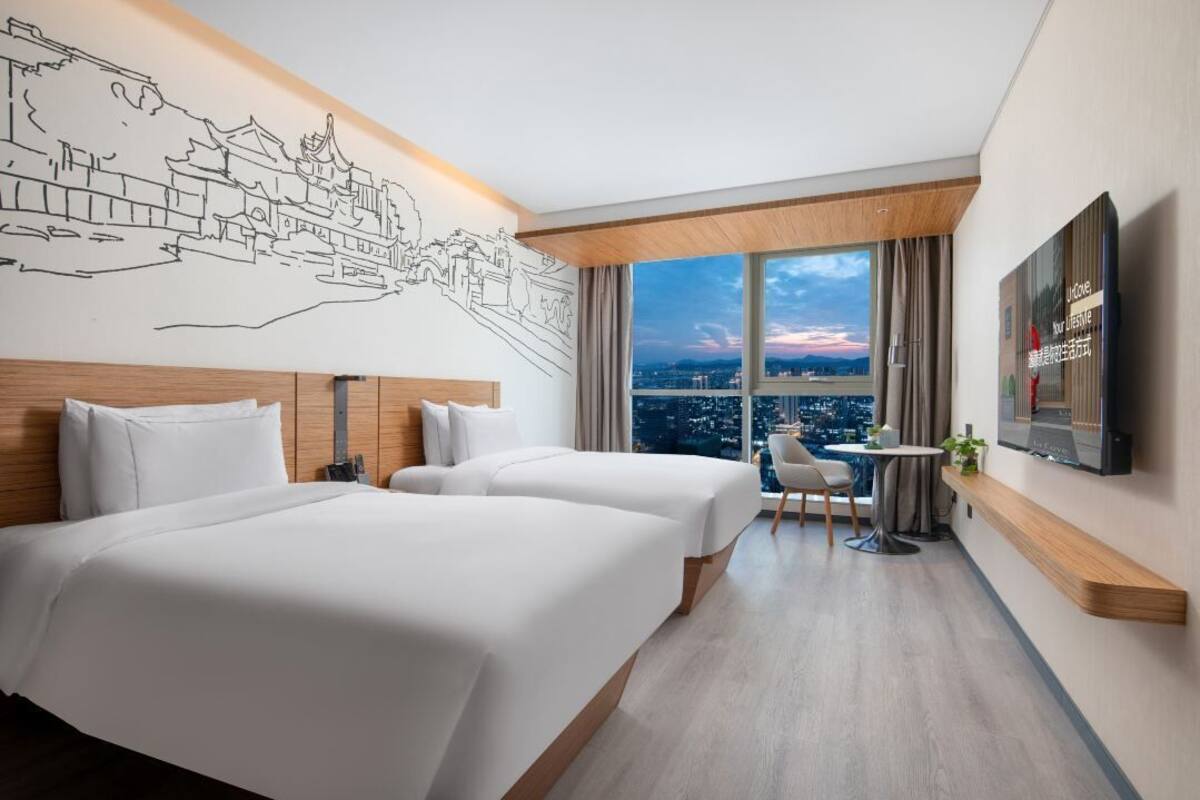 Chambre Deluxe Double ou avec lits jumeaux | Articles gratuits dans le mini-bar, coffres-forts dans les chambres