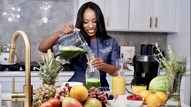 A kitchen with a modern design, featuring a stainless steel sink, a coffee maker, and a variety of fruits and vegetables on the counter. - Penthouse w Rooftop, Private Chef, Secure Parking (Atlanta)