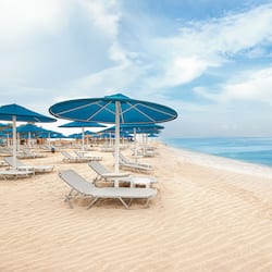 Private beach, beach umbrellas, beach towels, beach bar
