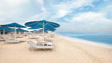 Private beach, beach umbrellas, beach towels, beach bar