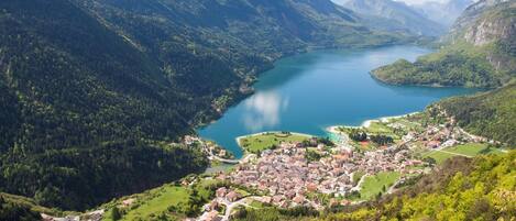 A mountainous landscape with a lake and a town.
