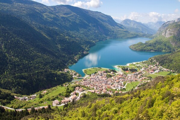A mountainous landscape with a lake and a town.