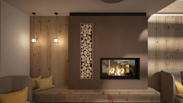 Ein modernes Wohnzimmer mit Kamin, Holzwandverkleidung und einer Sitzecke mit Kissen.