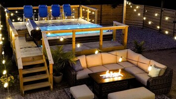 By day or night the swim spa sets the tone for gathering. A hot day: turn the heat down so you've got a heated swimming pool. A bit chilly: keep it "hot tub" temperature. From this wonderful amphitheater space, watch an outdoor projection movie,