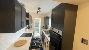Enjoy cooking in this well-equipped kitchen with an oven and microwave.