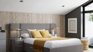 Un dormitorio moderno con una cama grande, mesitas de noche y vistas al exterior.
