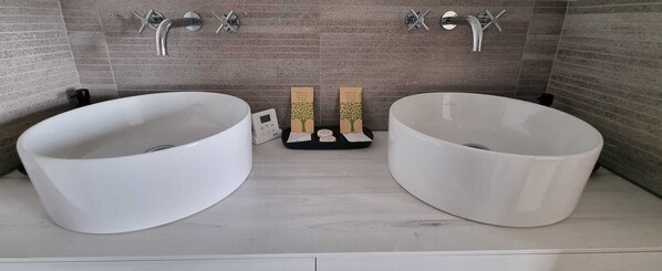 A bathroom with two large white sinks, a small digital scale, and two wooden boxes with tree designs. - magnificent villa with the most beautiful view of Tourtour and private pool (tourtour)