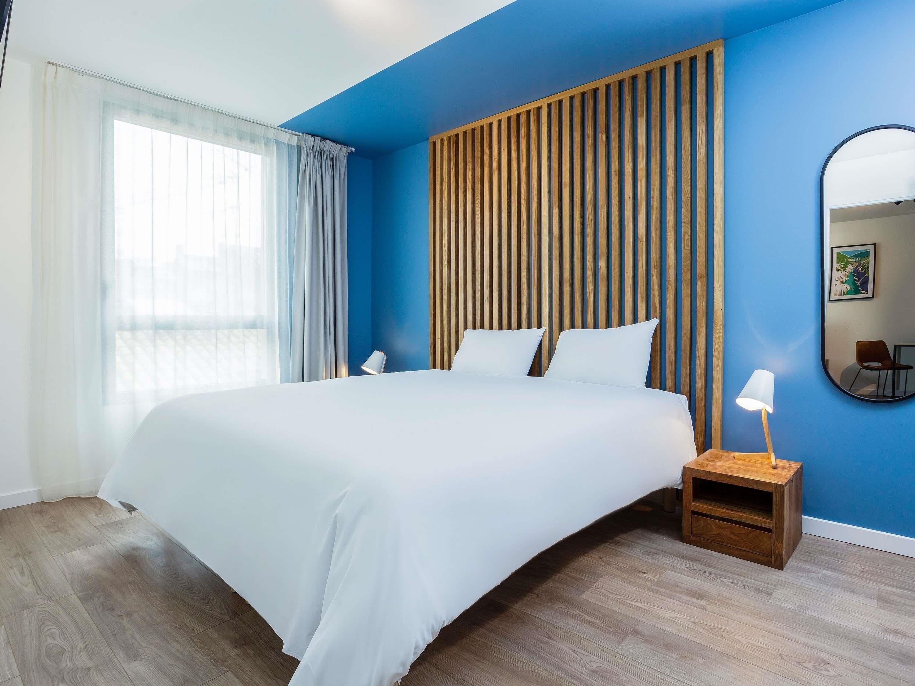 Pillowtop beds, desk, laptop workspace, soundproofing