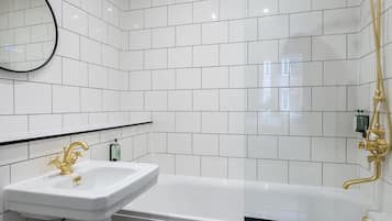 Bathtub, hair dryer, towels