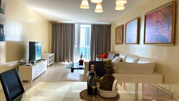 Design Condo | Living area | 32-inch Smart TV with cable channels, TV