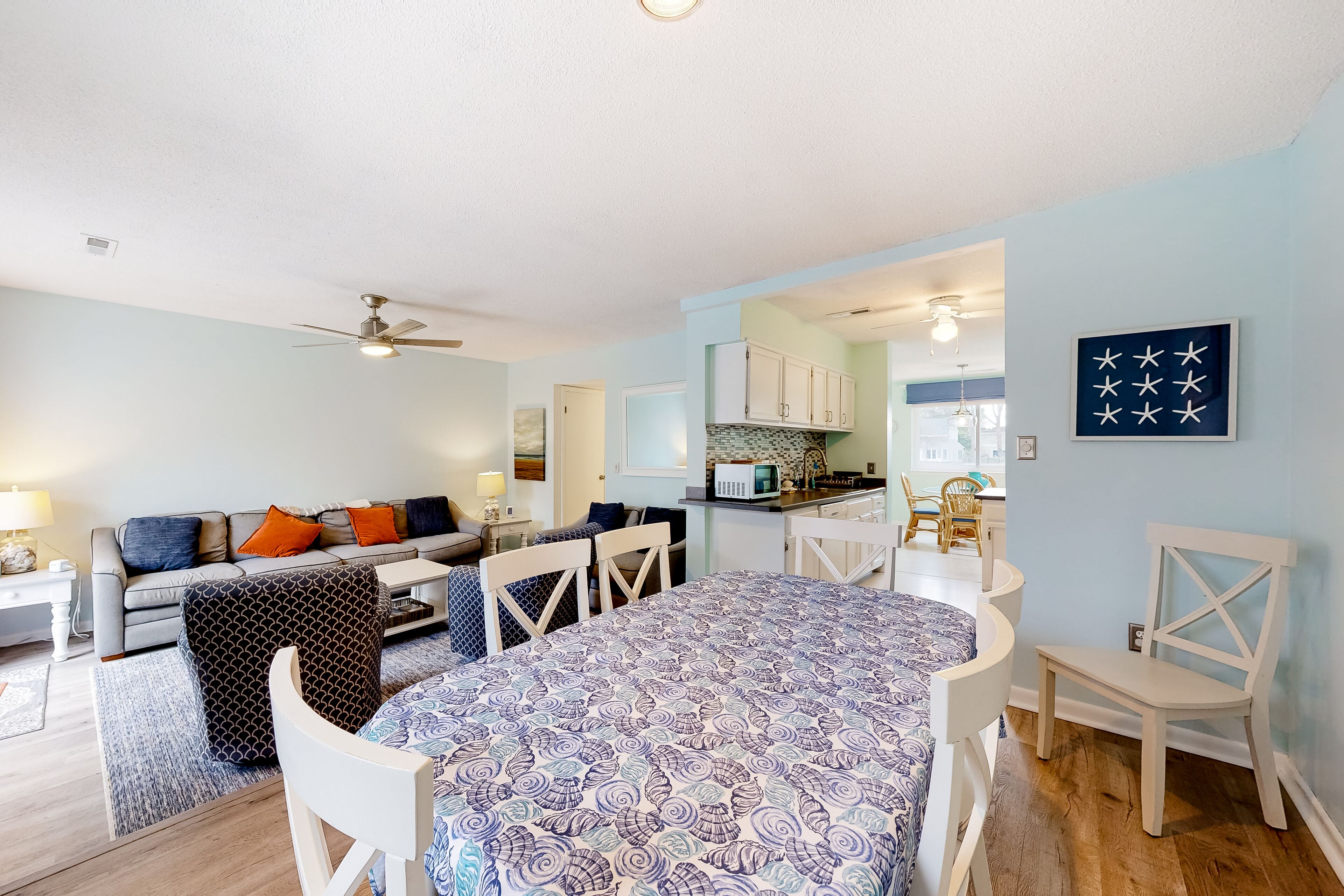 Town of Dewey Beach home with fireplace, gas grill, deck, W/D, & full kitchen