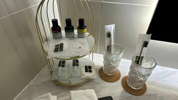 Shower, rainfall showerhead, hair dryer, towels
