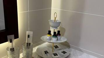 Shower, rainfall showerhead, hair dryer, towels