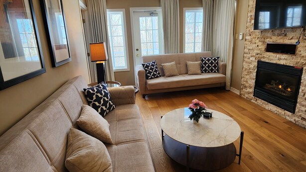 40-inch flat-screen TV with cable channels, TV, fireplace - Luxe Mode One Bedroom with Jetted Tub (Oro-Medonte)