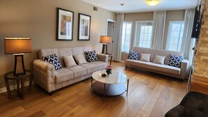 40-inch flat-screen TV with cable channels, TV, fireplace - Luxe Mode One Bedroom with Jetted Tub (Oro-Medonte)