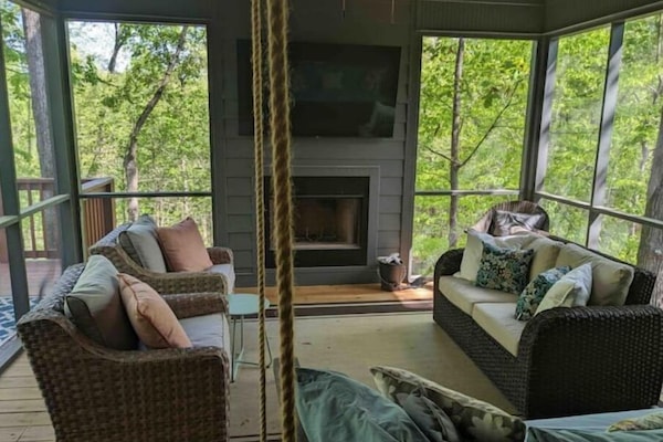 The screened in porch is a guest favorite. We love the outdoor fireplace.