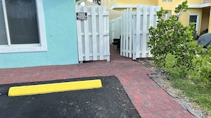 entrance to a secluded residence, marked by a clear pathway and accessible walkway.