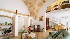 A spacious living area with a high ceiling, a dining area with a staircase, and a view of the upper floor. - 3278 Guest House Eleonora - Family by BarbarHouse (Alliste)