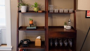 A wooden bookshelf with various decorative items and books.